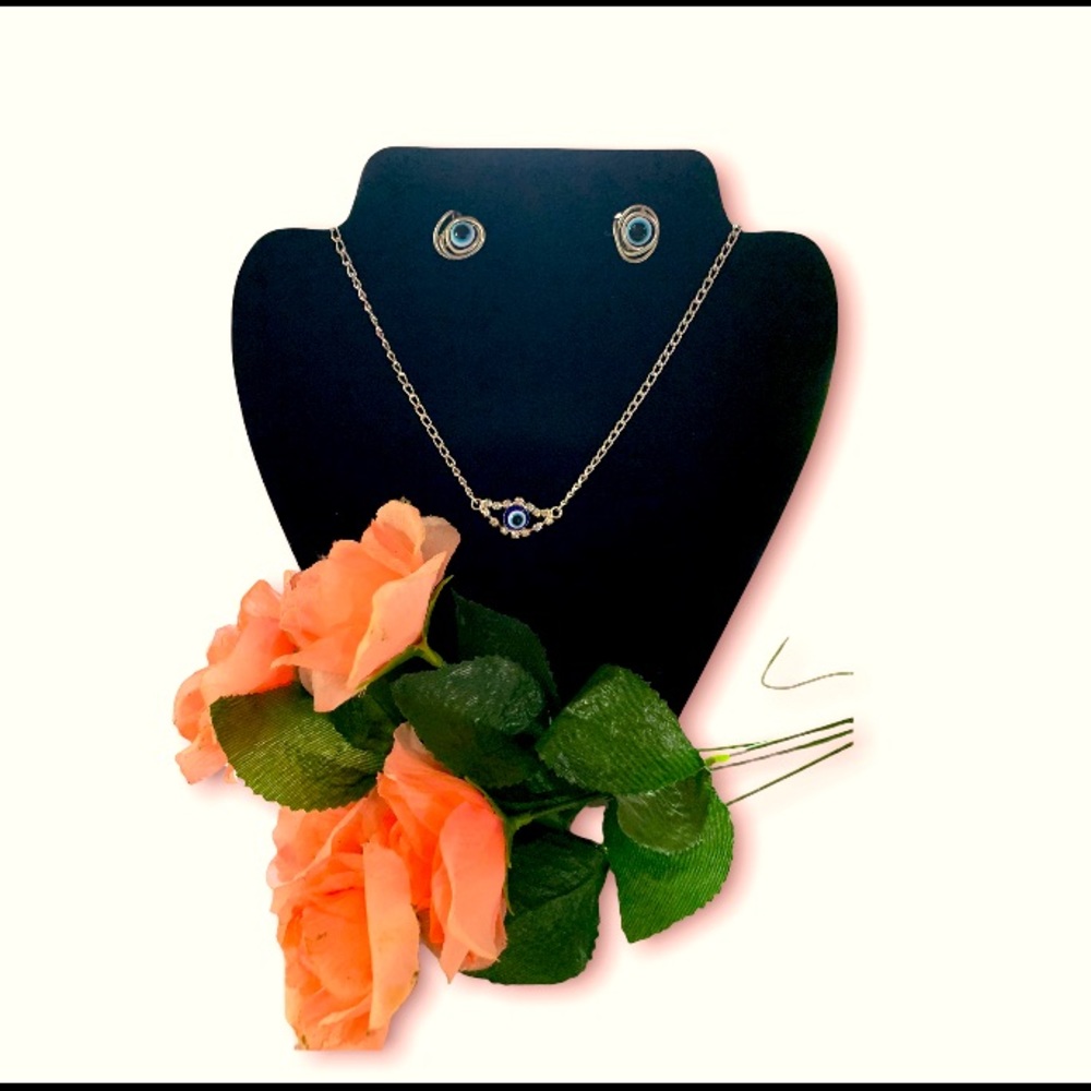 Handmade evil eye necklace and earring set .
